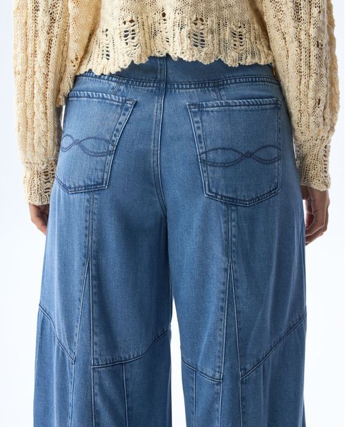 Jean Flare amplio con cortes para mujer