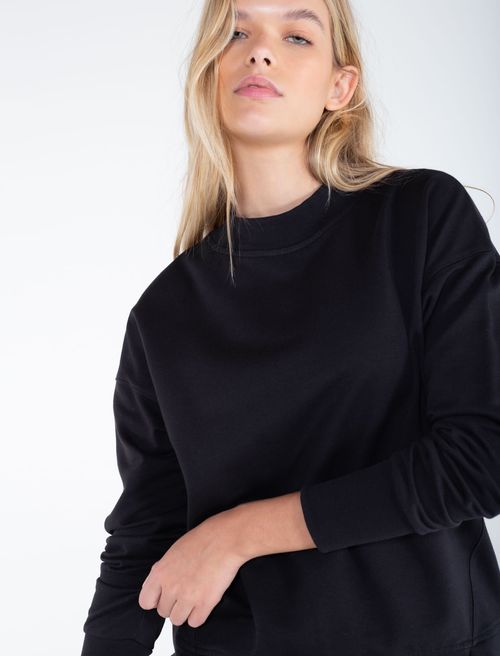 Buzo Hug con cortes en ruedo para mujer